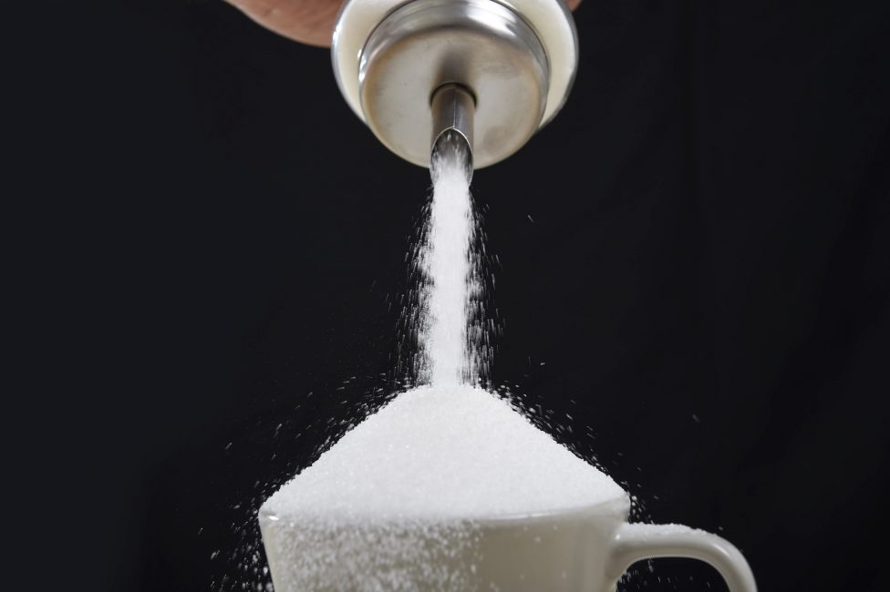 sugar pouring into cup