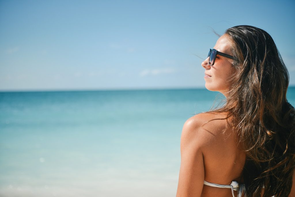woman wearing sunglasses at the beach