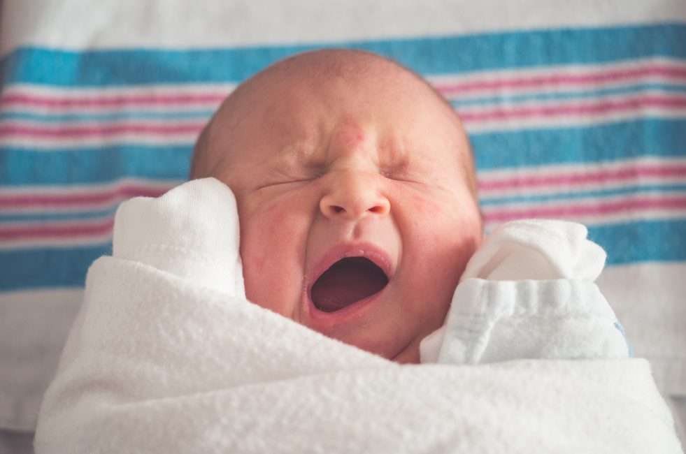 newborn baby yawning 