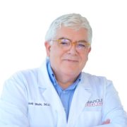 Picture of Dr. Mark Wade, Cardiologist in a white lab coat.