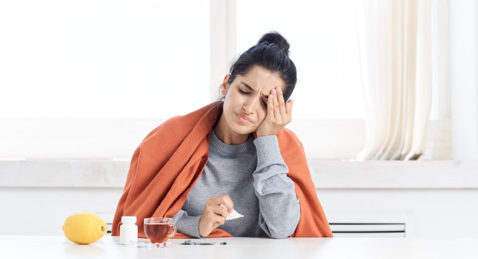 Women looking sick with possible flu symptoms